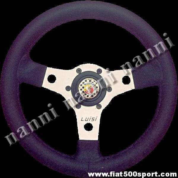 Art. 0010 - Volante Fiat 500 Abarth in pelle nera con razze satinate completo di mozzo e pulsante clacson Abarth. - Volante Fiat 500 Abarth in pelle nera con razze satinate.(Specificare se lo si desidera con mozzo per 126). Il diametro esterno è di 315 mm.
Art. 0010 - Volante Fiat 500 Abarth in pelle nera con razze satinate completo di mozzo e pulsante clacson Abarth. - Volante Fiat 500 Abarth in pelle nera con razze satinate.(Specificare se lo si desidera con mozzo per 126). Il diametro esterno è di 315 mm.