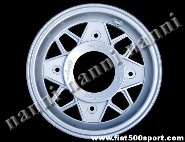 Art. 0074 - Cerchio ruota Fiat 500 in lega ultraleggera NANNI verniciato, da 4,5 pollici x 12 pollici completo di bulloni conici autocentranti. - Cerchio ruota Fiat 500 Fiat 126 prima serie NANNI in lega ultraleggera di altissima qualita’, verniciato, da 4,5 pollici x 12 pollici completo di bulloni conici autocentranti di fissaggio (interasse bulloni ruota 190 mm.). ET 45.
Art. 0074 - Cerchio ruota Fiat 500 in lega ultraleggera NANNI verniciato, da 4,5 pollici x 12 pollici completo di bulloni conici autocentranti. - Cerchio ruota Fiat 500 Fiat 126 prima serie NANNI in lega ultraleggera di altissima qualita’, verniciato, da 4,5 pollici x 12 pollici completo di bulloni conici autocentranti di fissaggio (interasse bulloni ruota 190 mm.). ET 45.