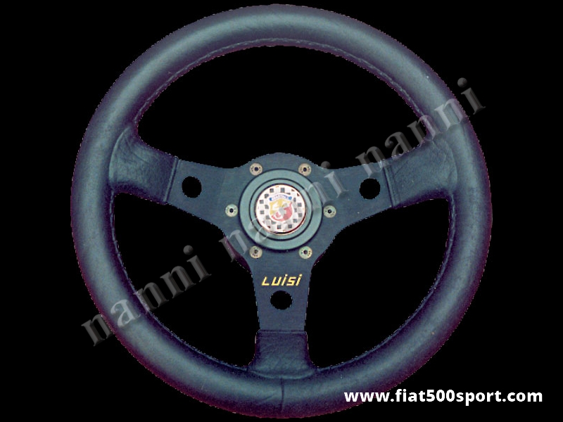 Art. 0012 - Volante Fiat 500 Fiat 126 Abarth in pelle nera a calice con razze nere completo di mozzo e pulsante clacson Abarth. - Volante Fiat 500 Fiat 126 Abarth in pelle nera a calice con razze nere completo di mozzo per Fiat 500 e pulsante clacson Abarth. (specificare nelle note se lo si desidera con mozzo per 126) Il diametro esterno è di 315 mm. Ha un’ottima impugnatura essendo abbastanza grosso e morbido.
