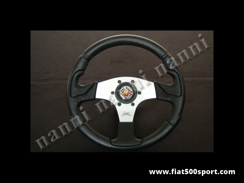 Art. 0051 - Volante Fiat 500 Abarth con razze satinate completo di mozzo e pulsante clacson Abarth. - Volante Fiat 500 Abarth con razze satinate.(specificare se lo si desidera con mozzo per 126). Il diametro esterno è di 320 mm.
Art. 0051 - Volante Fiat 500 Abarth con razze satinate completo di mozzo e pulsante clacson Abarth. - Volante Fiat 500 Abarth con razze satinate.(specificare se lo si desidera con mozzo per 126). Il diametro esterno è di 320 mm.