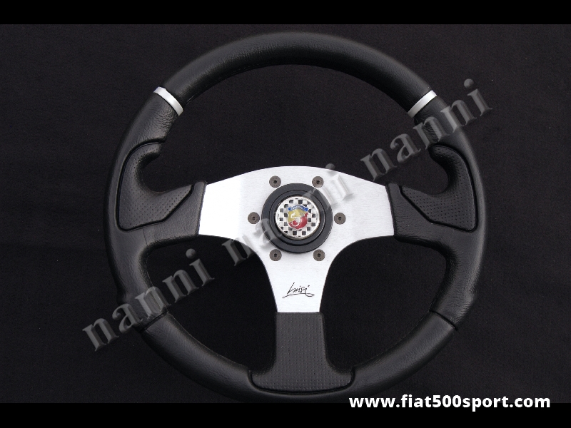 Art. 0051 - Volante  Fiat  500 Fiat 126 Abarth con razze satinate a calice, ergonomico, completo di mozzo e pulsante clacson Abarth. - Volante Fiat 500 Fiat 126 Abarth con razze satinate a calice, ergonomico con pulsante clacson Abarth e mozzo per Fiat 500. (specificare nelle note se lo si desidera con mozzo per 126). Il diametro esterno è di 320 mm.
