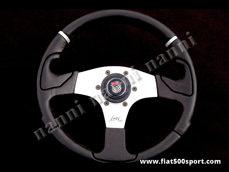 Art. 0052 - Volante Fiat 500 Fiat 126 Giannini con razze satinate completo di mozzo e pulsante clacson Giannini. - Volante Fiat 500 Fiat 126 Giannini con razze satinate.(specificare nelle note se lo si desidera con mozzo per 126). Il diametro esterno è di 320 mm.
Art. 0052 - Volante Fiat 500 Fiat 126 Giannini con razze satinate completo di mozzo e pulsante clacson Giannini. - Volante Fiat 500 Fiat 126 Giannini con razze satinate.(specificare nelle note se lo si desidera con mozzo per 126). Il diametro esterno è di 320 mm.