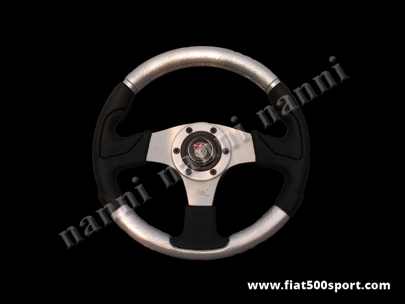 Art. 0056 - Volante Fiat 500 Giannini in pelle color argento, completo di mozzo e pulsante clacson Giannini. - Volante Fiat 500 Giannini in pelle color argento.(specificare se lo si desidera con mozzo per 126). Il diametro esterno è di 320 mm.
Art. 0056 - Volante Fiat 500 Giannini in pelle color argento, completo di mozzo e pulsante clacson Giannini. - Volante Fiat 500 Giannini in pelle color argento.(specificare se lo si desidera con mozzo per 126). Il diametro esterno è di 320 mm.
