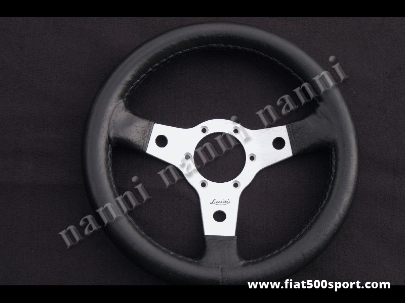 Art. 0100 - Volante in pelle nera con razze satinate. Diametro 315 mm. - Volante in pelle con razze satinate. Diametro 315 mm.
Art. 0100 - Volante in pelle nera con razze satinate. Diametro 315 mm. - Volante in pelle con razze satinate. Diametro 315 mm.