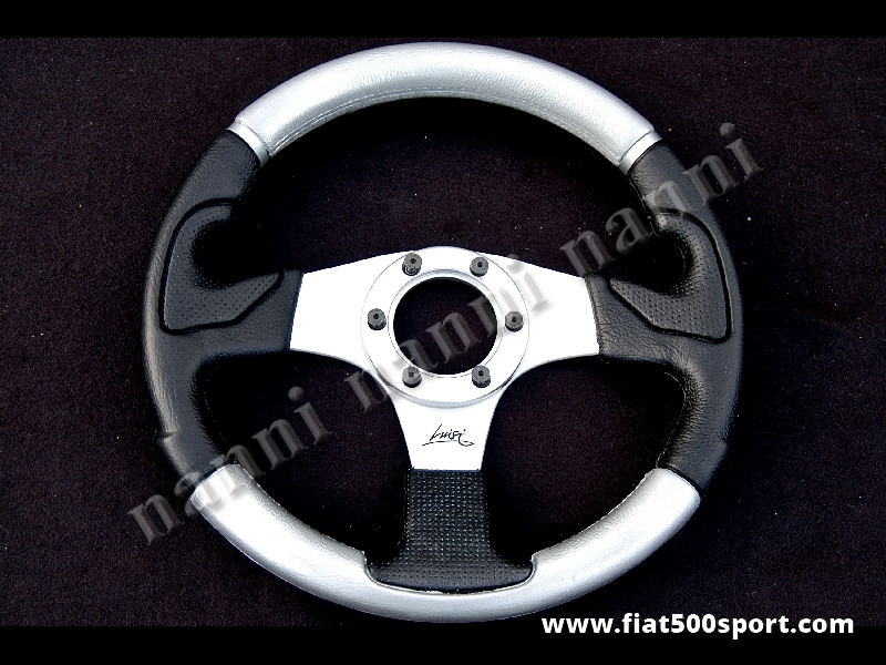 Art. 0103A - Steering wheel silver leather satined spokes. Diameter 320 mm. - Steering wheel silver leather with satined spokes. Diameter 320 mm.
