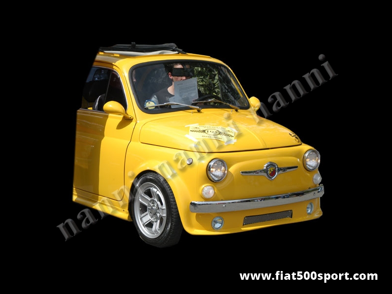 Art. 0850 - Spoiler Fiat 500 anteriore NANNI con predisposizione fari e radiatore dell’olio - Spoiler anteriore Fiat 500 NANNI con predisposizione fari e radiatore dell’olio. Si può fissare con rivetti all’altezza desiderata e si può verniciare in qualsiasi colore. Si possono montare fari antinebbia originali Fiat Lancia.
