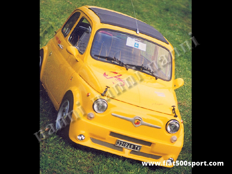 Art. 0856 - Paraurti Fiat 500 anteriore NANNI in vetroresina con spoiler e predisposizione fari. - Paraurti Fiat 500 anteriore NANNI in vetroresina con spoiler e predisposizione fari. Si monta con le staffe di supporto originali ed è verniciabile in qualsiasi colore. Si possono montare fari antinebbia Fiat Lancia.
